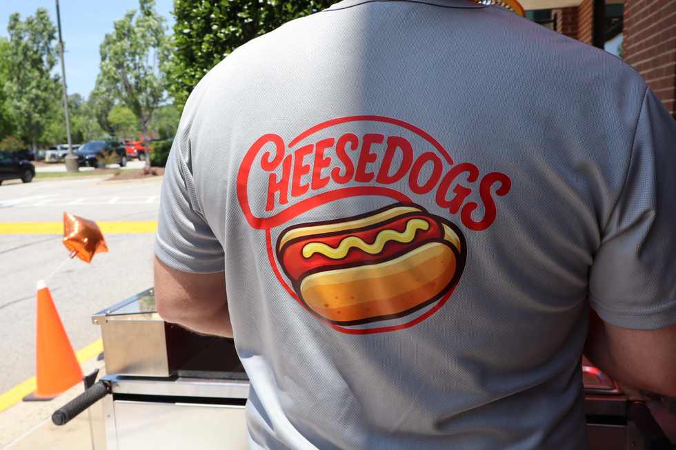 Cheesedogs cart detail with red umbrella and chips